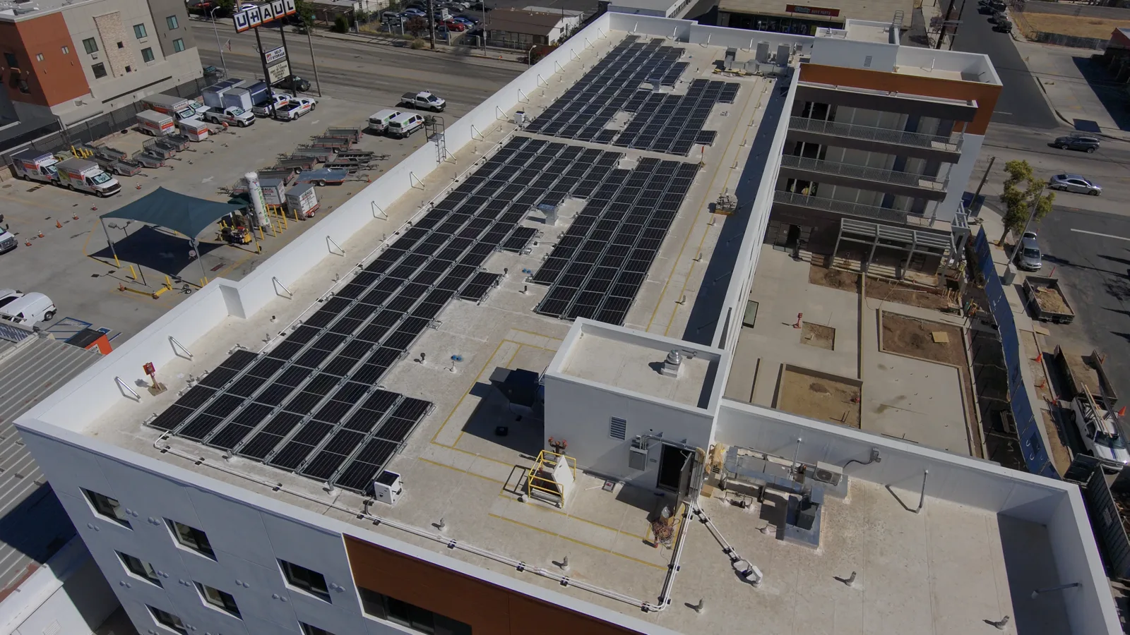 Commercial rooftop solar array at 21300 Devonshire, Chatsworth CA — drone view